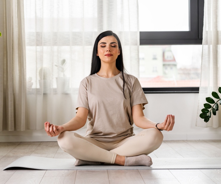 A woman meditating.