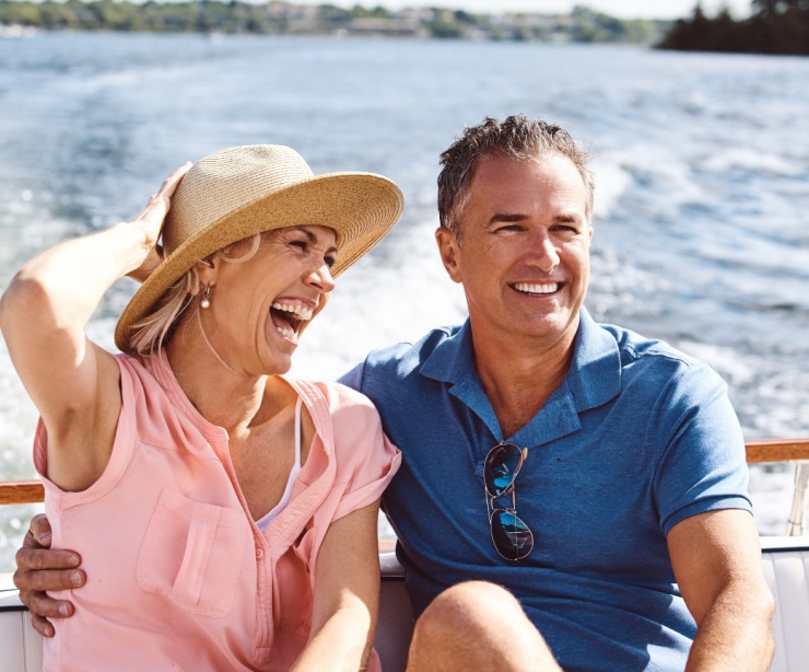 A couple on a yacht cruise.