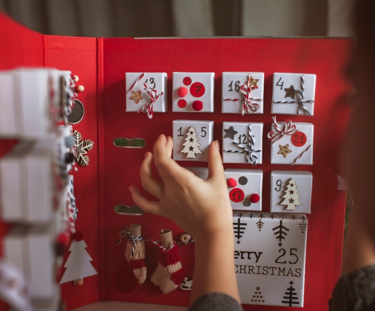 Someone opening a drawer of an Advent calendar.