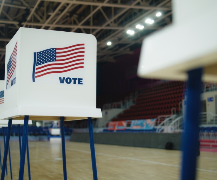 A voting booth with an American flag.