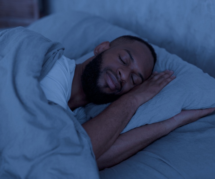 Man asleep in bed.